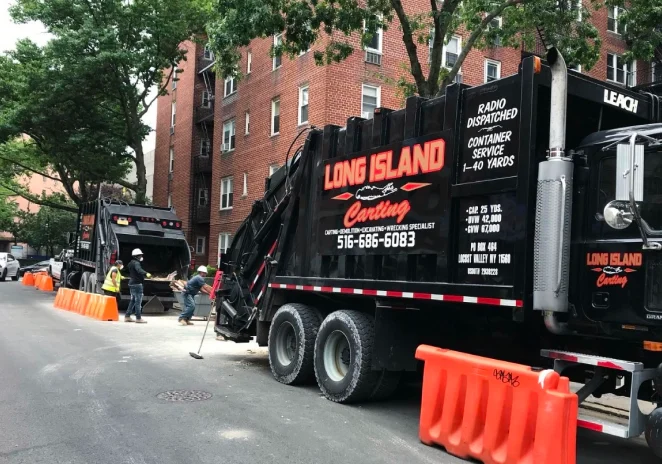 black dumpster with a long island carting logo