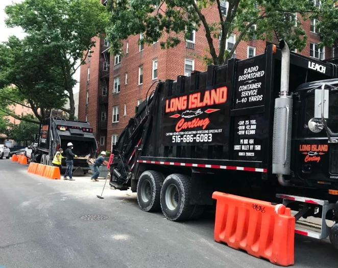 black dumpster with a long island carting logo