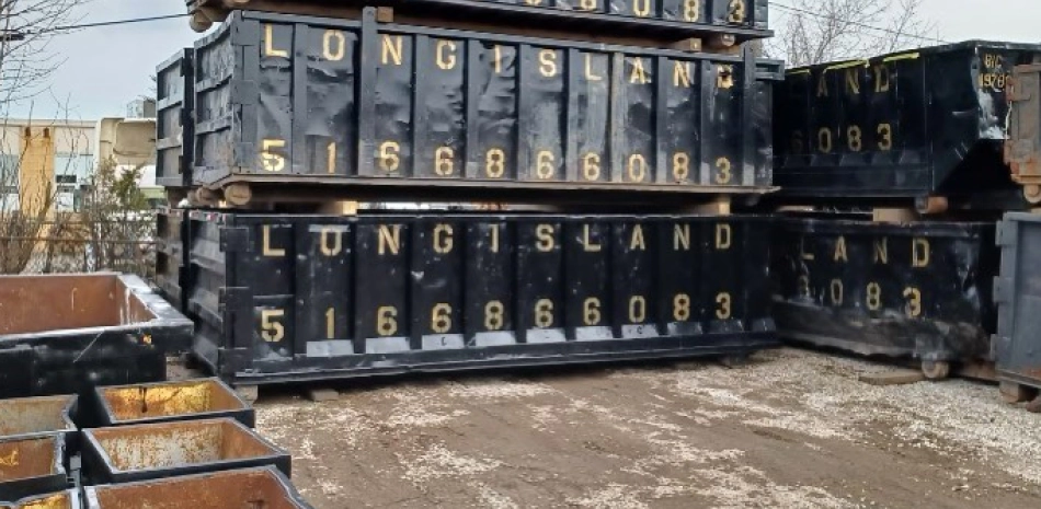 black dumpsters with some golden letters